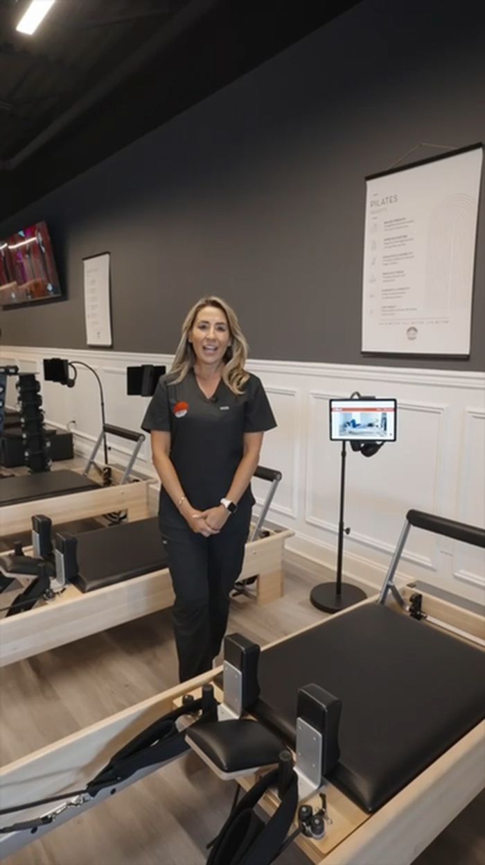 A team member in the Pilates reformer studio.